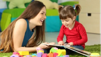 Mom reading book with kiddo